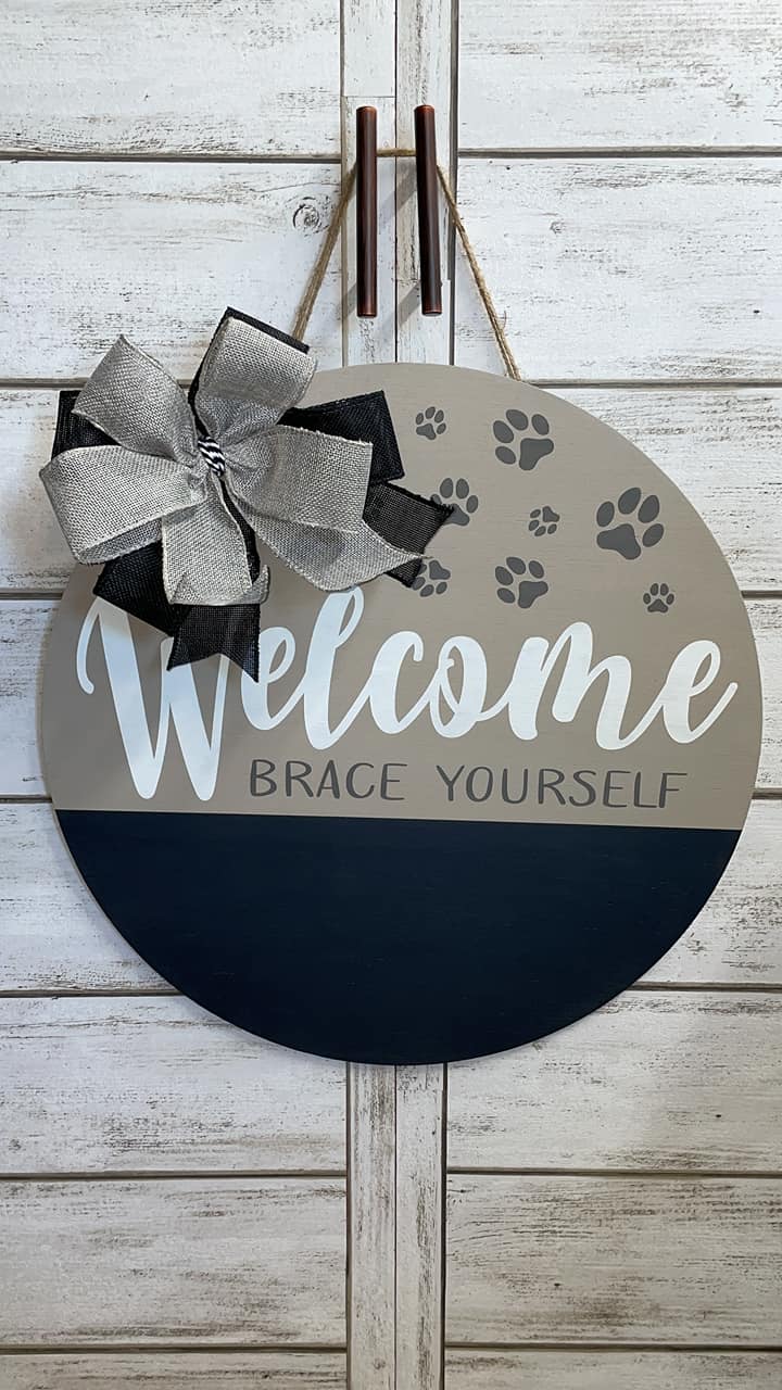 Welcome Brace Yourself paw print sign